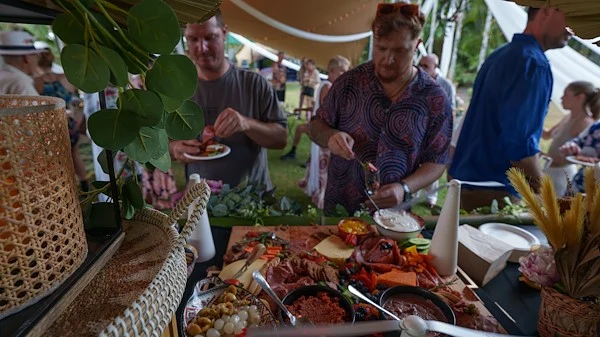 Wedding guests enjoying a shared buffet and grazing spread